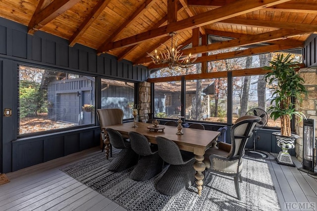 sunroom / solarium with wooden ceiling, a chandelier, and vaulted ceiling with beams