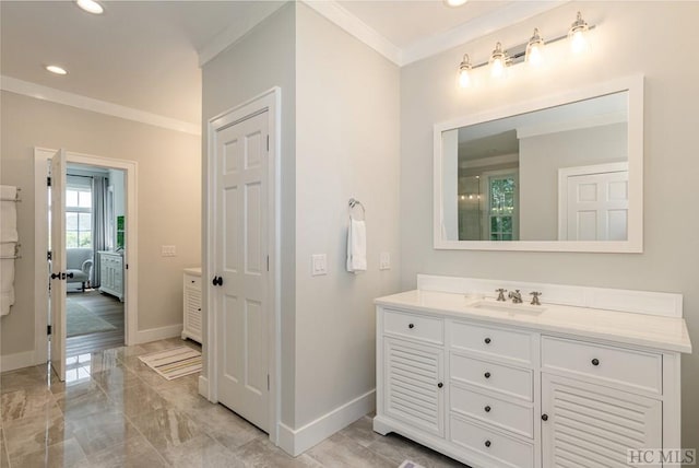 bathroom featuring vanity and ornamental molding