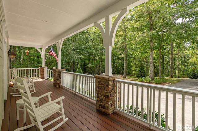 wooden terrace featuring a porch