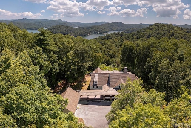 drone / aerial view with a water and mountain view