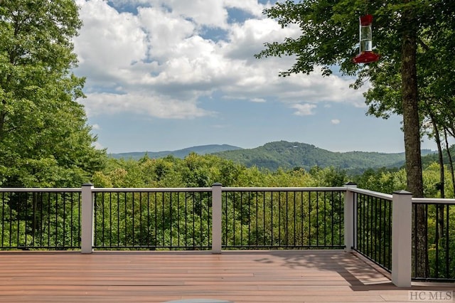 wooden deck with a mountain view