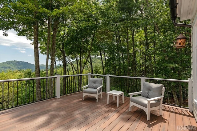 wooden deck featuring a mountain view