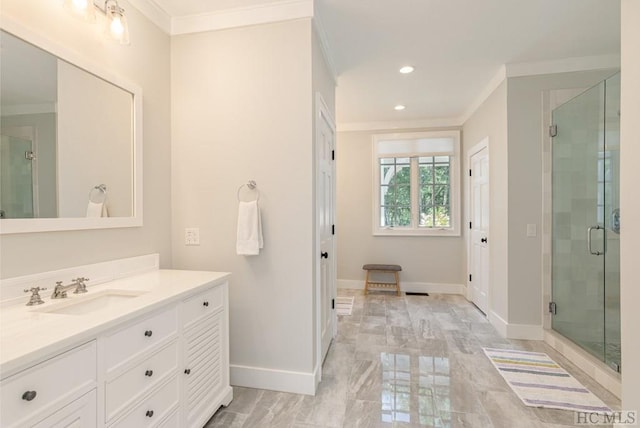 bathroom featuring vanity, crown molding, and a shower with door