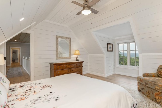 bedroom with lofted ceiling, ceiling fan, and light hardwood / wood-style floors