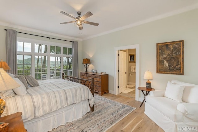 bedroom featuring ceiling fan, ensuite bath, crown molding, and light hardwood / wood-style floors