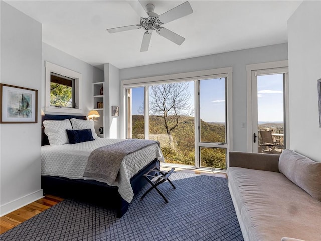 199 Mills Creek Point Rd, Lake Toxaway, NC 28747 - bedroom with access to outside, baseboards, a ceiling fan, and wood finished floors