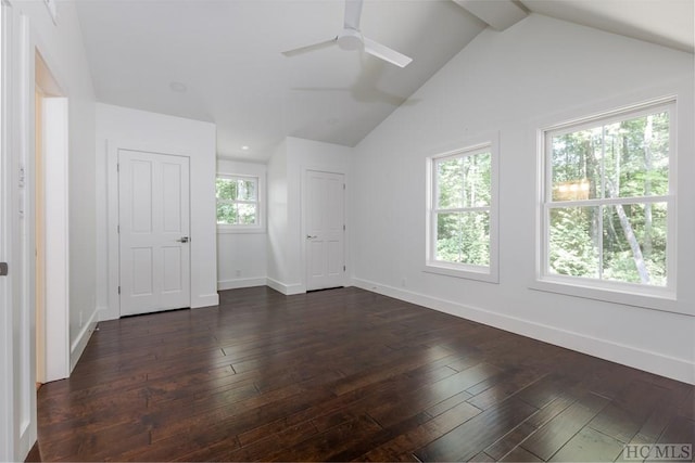 unfurnished room featuring lofted ceiling, dark hardwood / wood-style floors, and ceiling fan