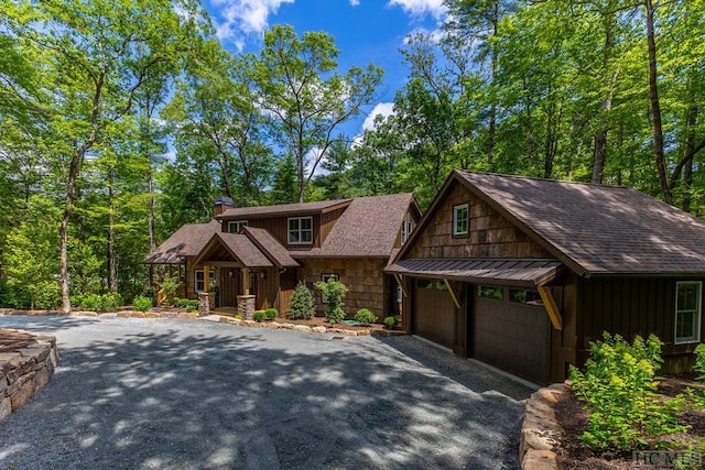 view of front facade featuring a carport and a garage