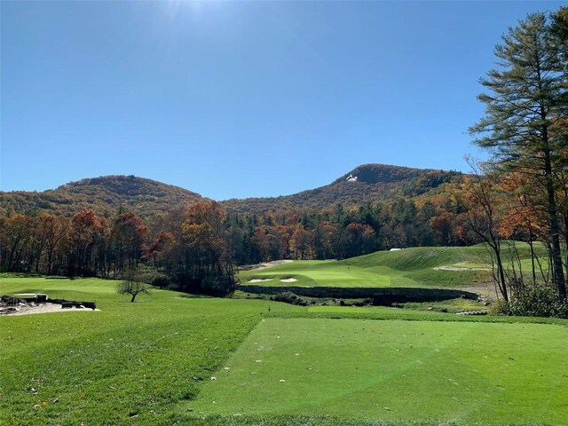 523 Broadview Dr, Highlands, NC 28741 - view of property's community with a mountain view, view of golf course, a yard, and a forest view
