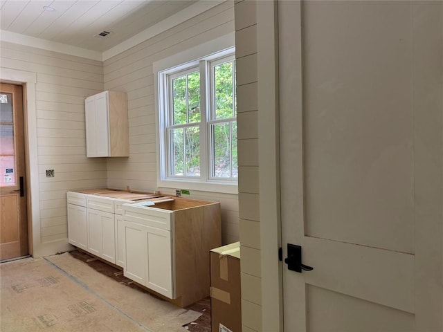 523 Broadview Dr, Highlands, NC 28741 - kitchen featuring white cabinetry, light countertops, and wooden walls