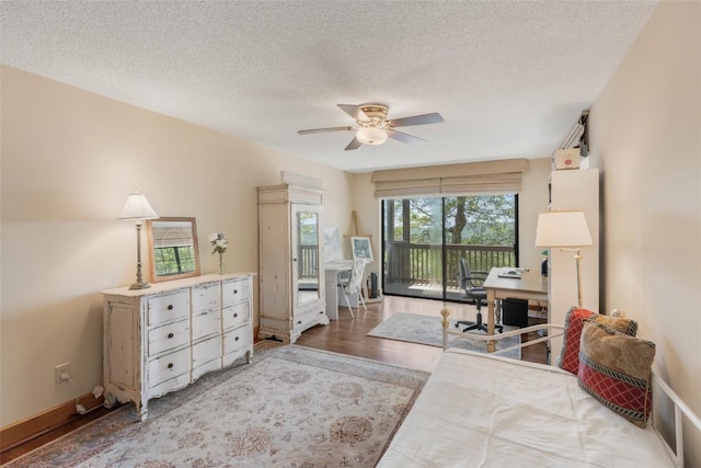 169 Heather View Ln, Sapphire, NC 28774 - bedroom with access to outside, wood finished floors, an office area, a textured ceiling, and a ceiling fan