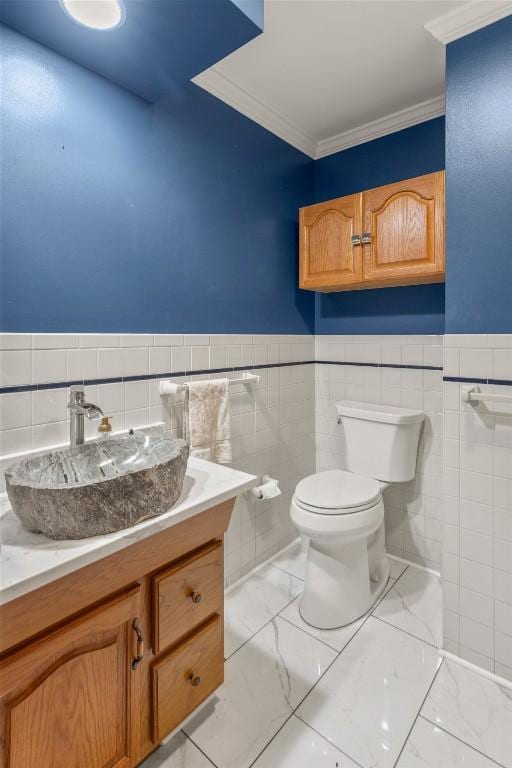 3398 Cullowhee Forest Rd, Cullowhee, NC 28723 - bathroom featuring tile walls, vanity, crown molding, and a wainscoted wall