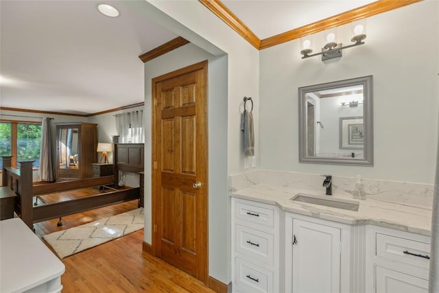 3398 Cullowhee Forest Rd, Cullowhee, NC 28723 - bathroom featuring crown molding, wood finished floors, and vanity