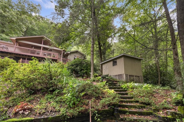 3398 Cullowhee Forest Rd, Cullowhee, NC 28723 - view of yard with stairway, a deck, and a wooded view