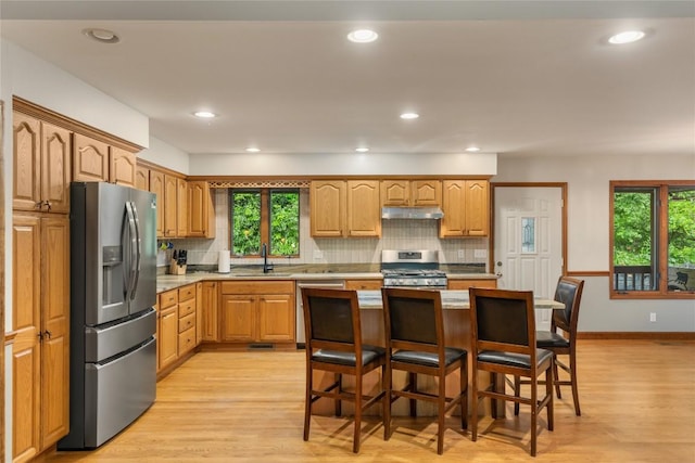 3398 Cullowhee Forest Rd, Cullowhee, NC 28723 - kitchen featuring stainless steel appliances, under cabinet range hood, light wood-type flooring, decorative backsplash, and recessed lighting