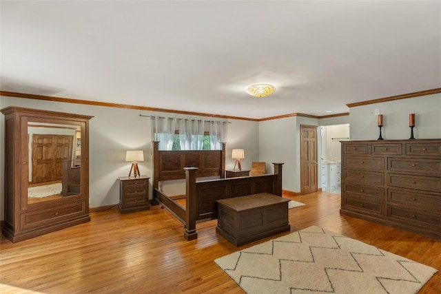 3398 Cullowhee Forest Rd, Cullowhee, NC 28723 - bedroom with light wood-style flooring, ornamental molding, and ensuite bathroom