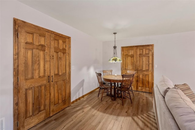 3398 Cullowhee Forest Rd, Cullowhee, NC 28723 - dining space featuring light wood-style floors and baseboards