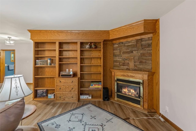 3398 Cullowhee Forest Rd, Cullowhee, NC 28723 - living area featuring a glass covered fireplace and wood finished floors