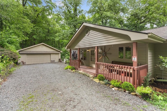 3398 Cullowhee Forest Rd, Cullowhee, NC 28723 - view of front facade featuring a garage, an outbuilding, covered porch, and roof with shingles