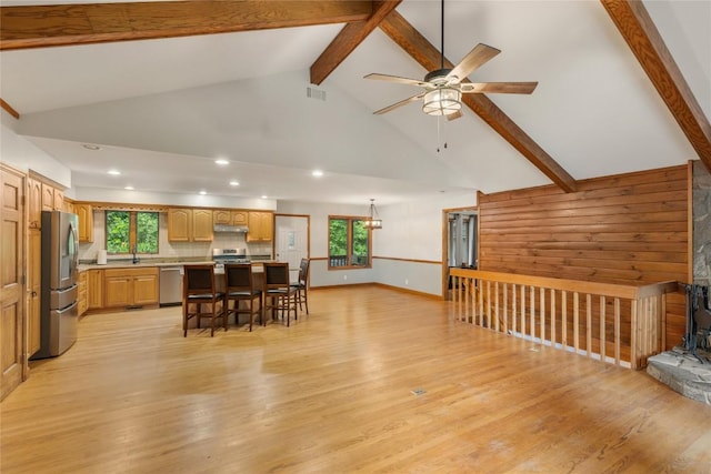 3398 Cullowhee Forest Rd, Cullowhee, NC 28723 - kitchen featuring appliances with stainless steel finishes, under cabinet range hood, beamed ceiling, a ceiling fan, and light wood-type flooring