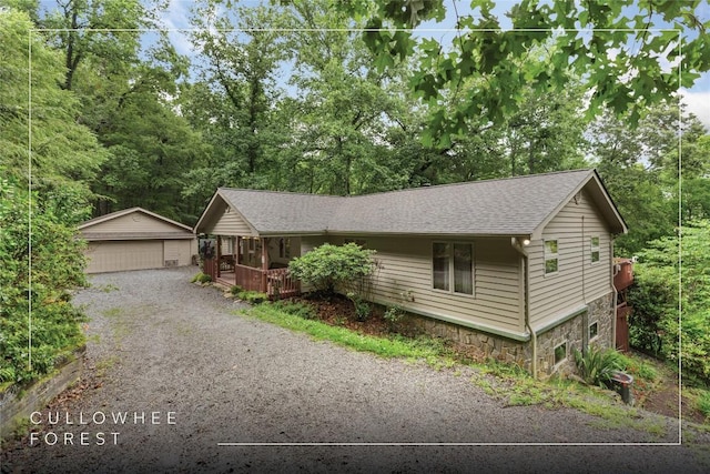 3398 Cullowhee Forest Rd, Cullowhee, NC 28723 - ranch-style home with an outdoor structure, roof with shingles, a detached garage, covered porch, and stone siding