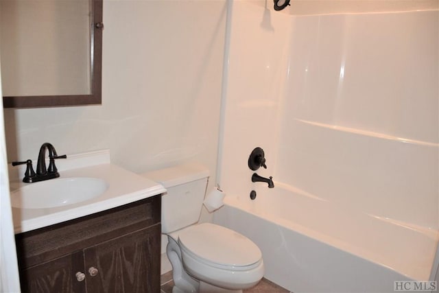 full bathroom with vanity, toilet, and  shower combination