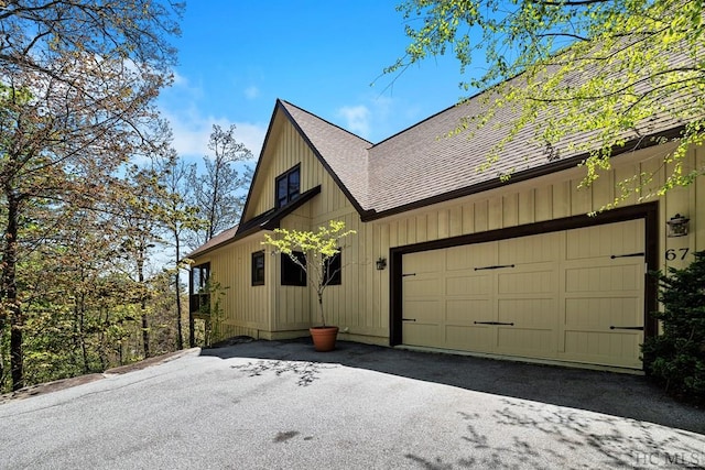 view of side of property with a garage