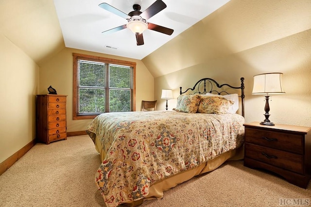 carpeted bedroom with lofted ceiling and ceiling fan