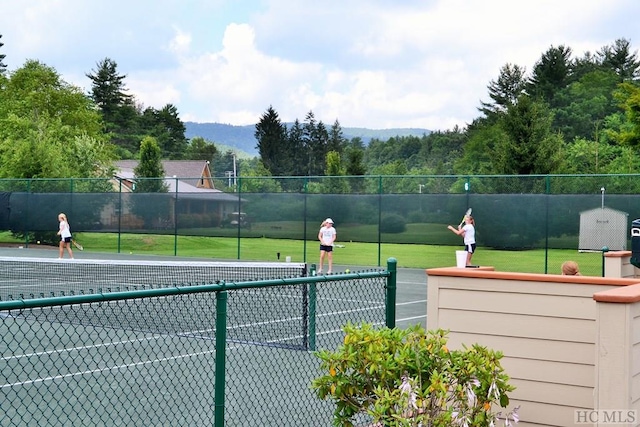 view of sport court with a mountain view