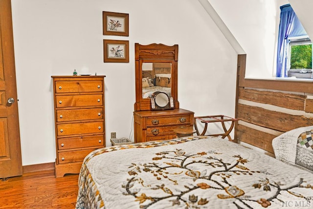 bedroom with hardwood / wood-style floors