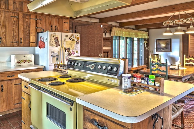 kitchen with beam ceiling, range, white refrigerator with ice dispenser, range hood, and pendant lighting