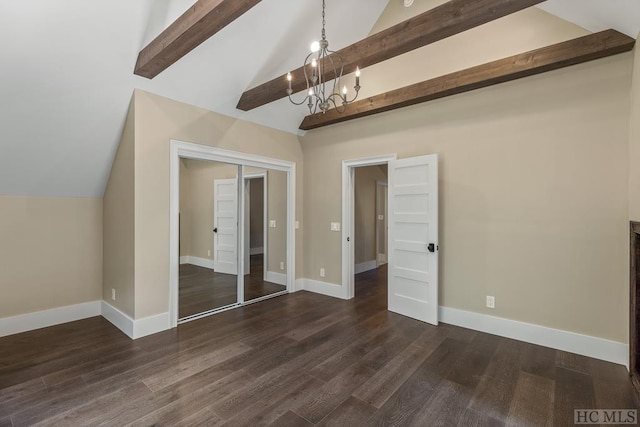 interior space with dark hardwood / wood-style floors, a chandelier, high vaulted ceiling, and a closet