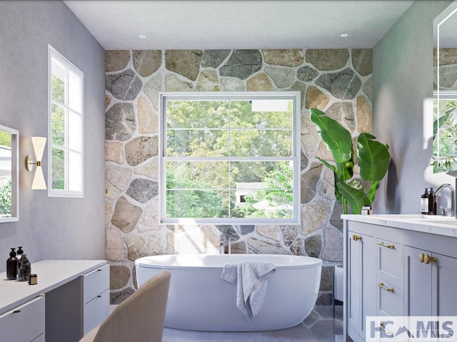 bathroom with a freestanding bath and vanity