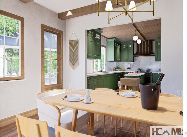 dining room featuring a chandelier, wooden ceiling, and wood finished floors