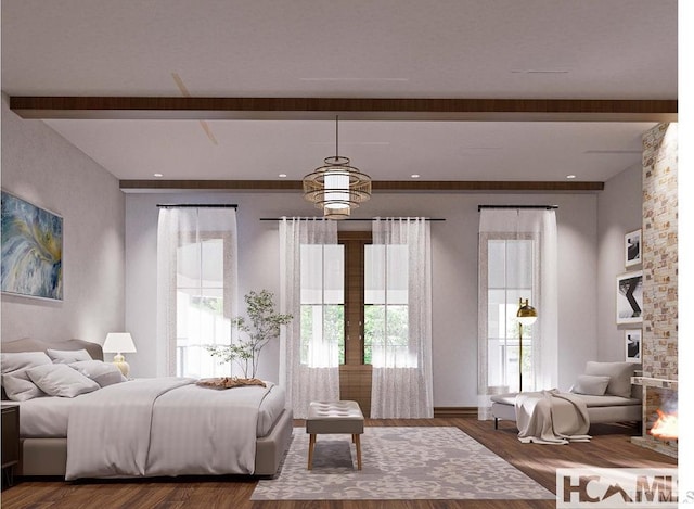 bedroom featuring wood finished floors, beamed ceiling, and baseboards
