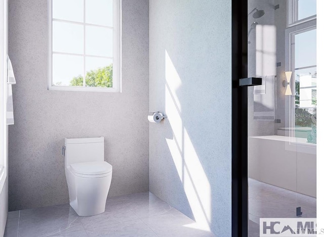 bathroom featuring a shower and toilet