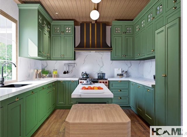 kitchen with light countertops, wood ceiling, custom range hood, and a sink
