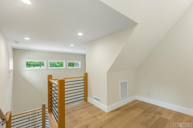 stairway featuring hardwood / wood-style floors