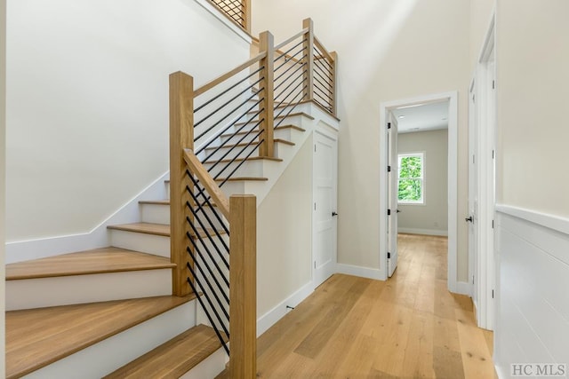 stairway featuring wood-type flooring