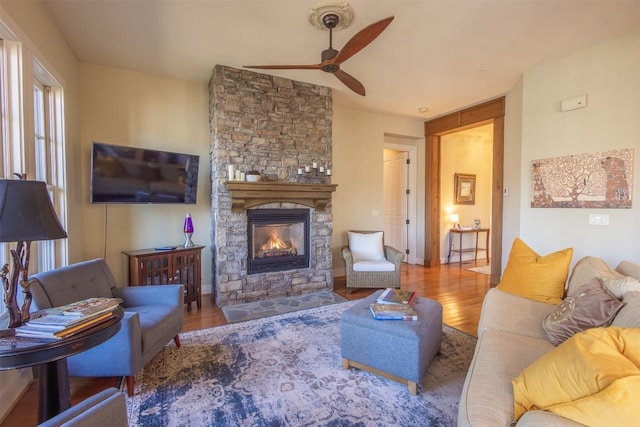 103 Southshore Dr Unit A1, Tuckasegee, NC 28783 - living area featuring a stone fireplace, wood finished floors, and ceiling fan