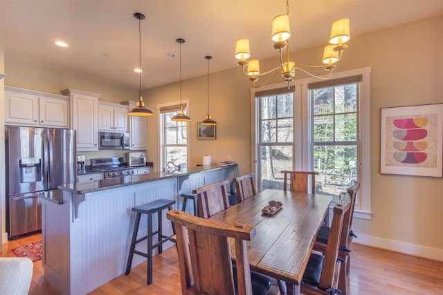 103 Southshore Dr Unit A1, Tuckasegee, NC 28783 - dining area with recessed lighting, baseboards, an inviting chandelier, and light wood finished floors