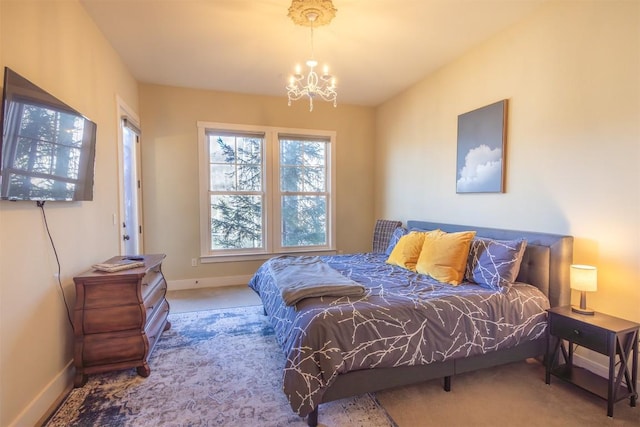 103 Southshore Dr Unit A1, Tuckasegee, NC 28783 - carpeted bedroom with a notable chandelier and baseboards