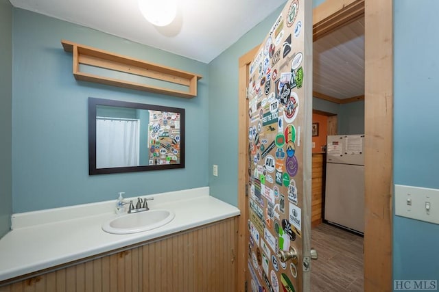 bathroom featuring vanity and wood-type flooring