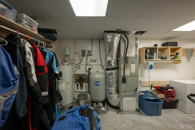 utility room featuring water heater