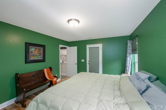 bedroom with wood-type flooring