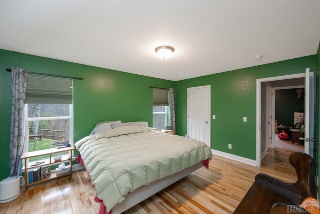 bedroom with light wood-type flooring