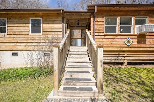 entrance to property featuring cooling unit