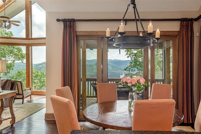 541 Summer Hill Rd, Cullowhee, NC 28723 - dining space featuring wood-type flooring, ceiling fan, a mountain view, and a chandelier