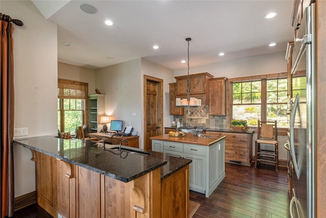 541 Summer Hill Rd, Cullowhee, NC 28723 - kitchen with stainless steel refrigerator, healthy amount of natural light, dark wood-type flooring, an island with sink, and recessed lighting