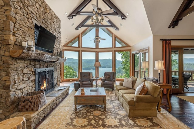 541 Summer Hill Rd, Cullowhee, NC 28723 - living room featuring a stone fireplace, wood finished floors, and a ceiling fan